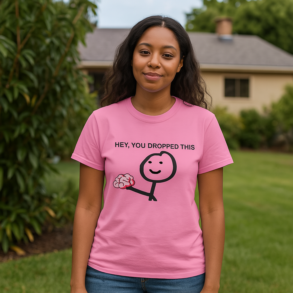 Young woman wearing pink funny tee shirt with Hey You Dropped Your Brains.