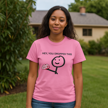 Young woman wearing pink funny tee shirt with Hey You Dropped Your Brains.