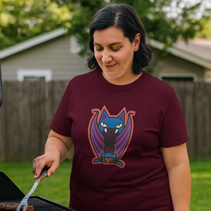 Woman wearing Nocturnal Fury maroon tee shirt in backyard at a grill.